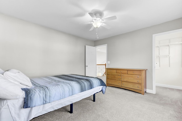 carpeted bedroom with baseboards and ceiling fan