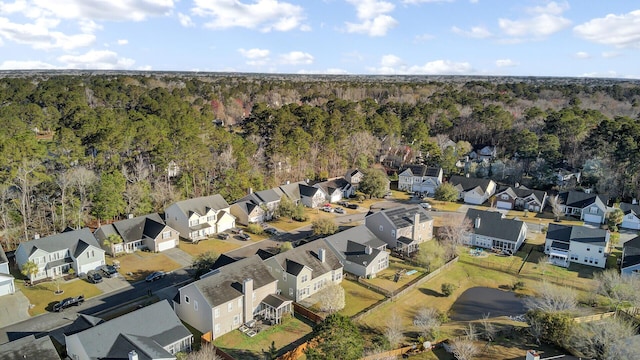 aerial view with a forest view and a residential view