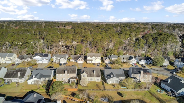 birds eye view of property with a wooded view and a residential view