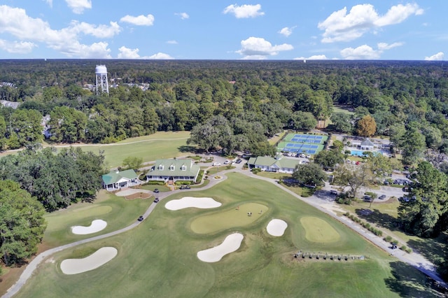 bird's eye view featuring golf course view and a view of trees