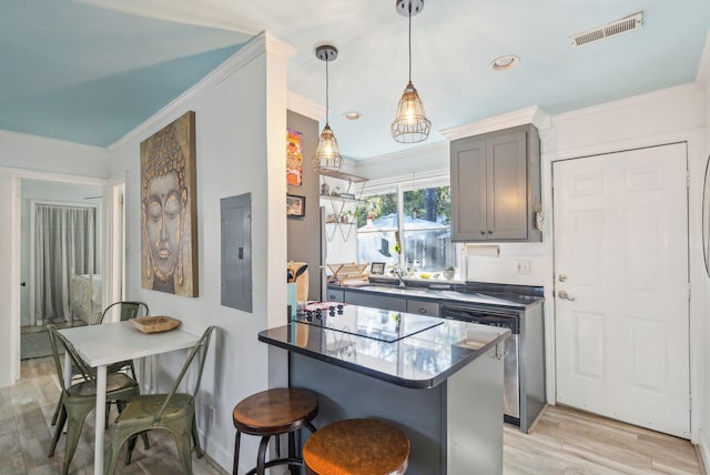 kitchen featuring electric panel, black electric stovetop, light hardwood / wood-style flooring, decorative light fixtures, and a kitchen bar