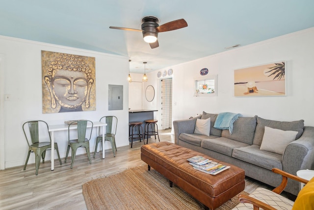 living room with ceiling fan, light hardwood / wood-style floors, and ornamental molding