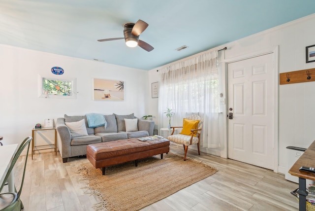 living room with ceiling fan and light hardwood / wood-style floors