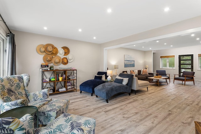 bedroom with baseboards, recessed lighting, and light wood-style floors