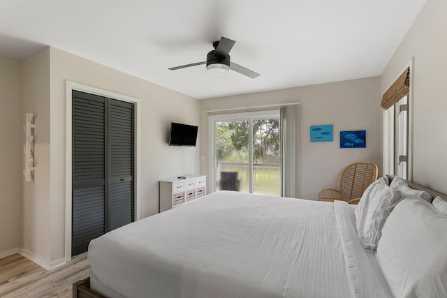 bedroom featuring a ceiling fan, baseboards, light wood-style floors, access to exterior, and a closet