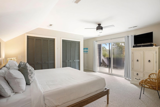 bedroom with visible vents, carpet, access to outside, vaulted ceiling, and multiple closets