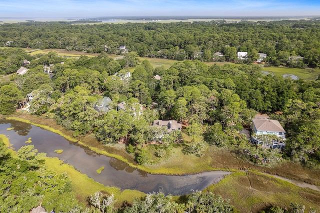 bird's eye view with a water view and a forest view