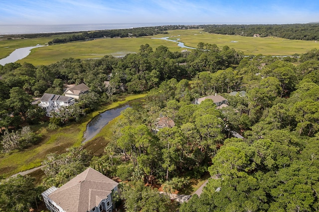 aerial view featuring a water view and a wooded view