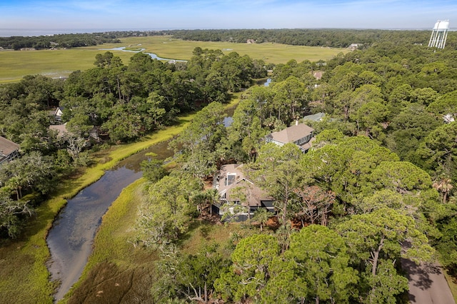 birds eye view of property with a forest view