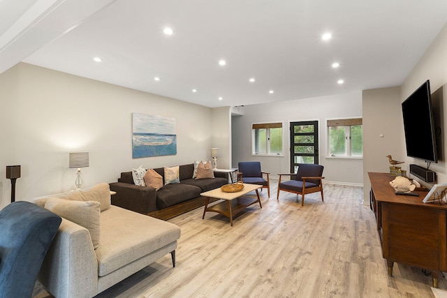 living room featuring baseboards, light wood finished floors, and recessed lighting