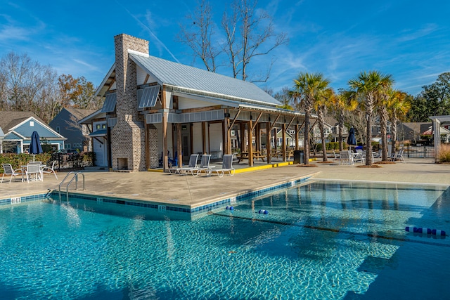 view of swimming pool featuring a patio area