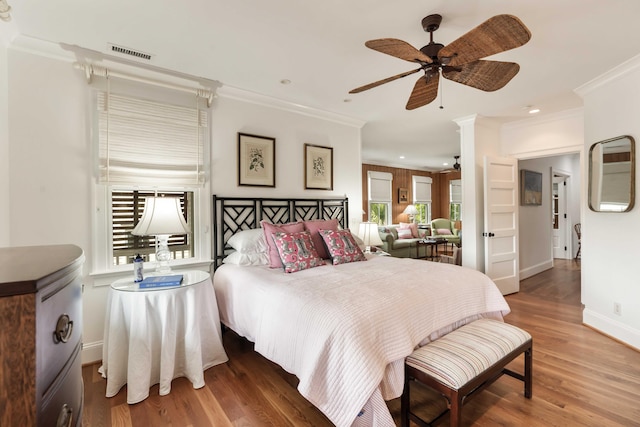 18 Fernandina St, Mount Pleasant, SC 29464 - bedroom featuring crown molding, baseboards, wood finished floors, recessed lighting, and a ceiling fan