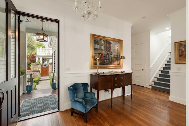 18 Fernandina St, Mount Pleasant, SC 29464 - living area featuring a chandelier, stairway, wood finished floors, ornamental molding, and wainscoting