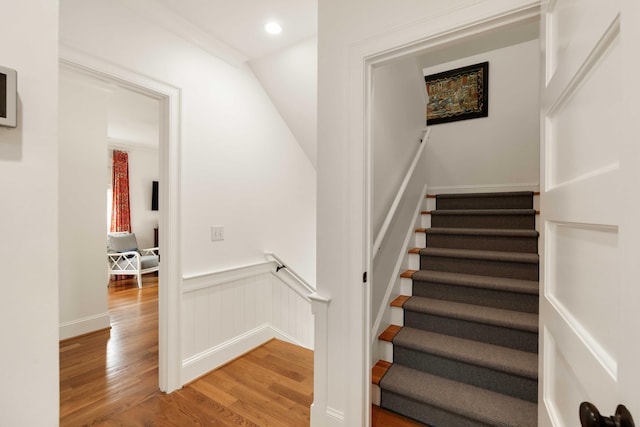 18 Fernandina St, Mount Pleasant, SC 29464 - stairs with wood finished floors and a wainscoted wall