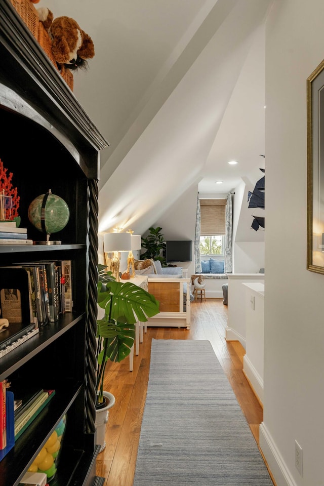 18 Fernandina St, Mount Pleasant, SC 29464 - living area with hardwood / wood-style flooring, lofted ceiling, and baseboards
