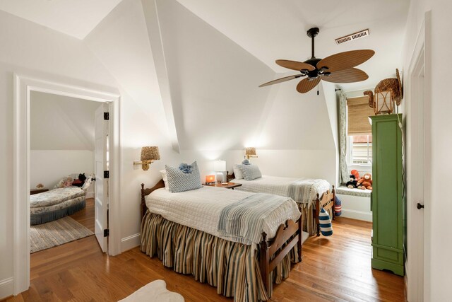 18 Fernandina St, Mount Pleasant, SC 29464 - bedroom with lofted ceiling, wood finished floors, and baseboards