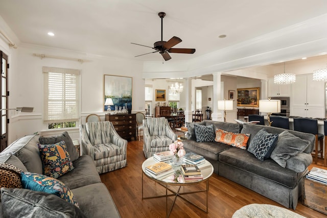 18 Fernandina St, Mount Pleasant, SC 29464 - living area with a ceiling fan, a chandelier, decorative columns, dark wood-type flooring, and crown molding