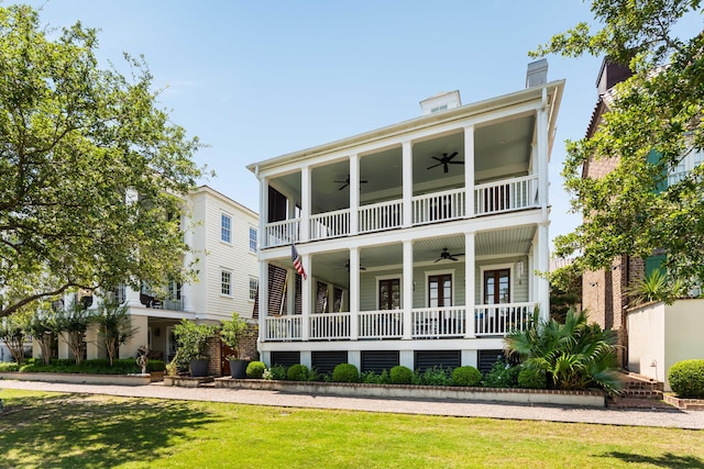 18 Fernandina St, Mount Pleasant, SC 29464 - greek revival inspired property with ceiling fan, a front yard, and a balcony