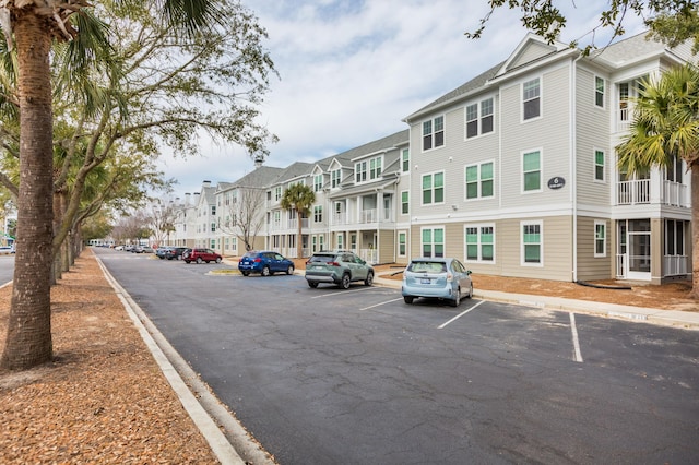 exterior space with uncovered parking and a residential view