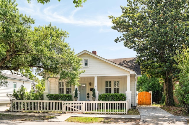 814 Rutledge Ave, Charleston, SC 29403 - bungalow featuring a gate, a fenced front yard, and covered porch
