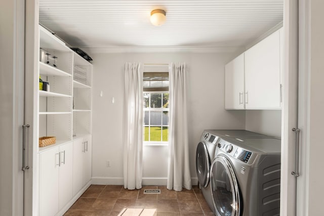 814 Rutledge Ave, Charleston, SC 29403 - washroom with cabinet space, independent washer and dryer, baseboards, and light tile patterned floors