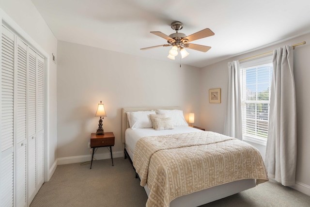 814 Rutledge Ave, Charleston, SC 29403 - bedroom featuring light carpet, baseboards, a closet, and ceiling fan