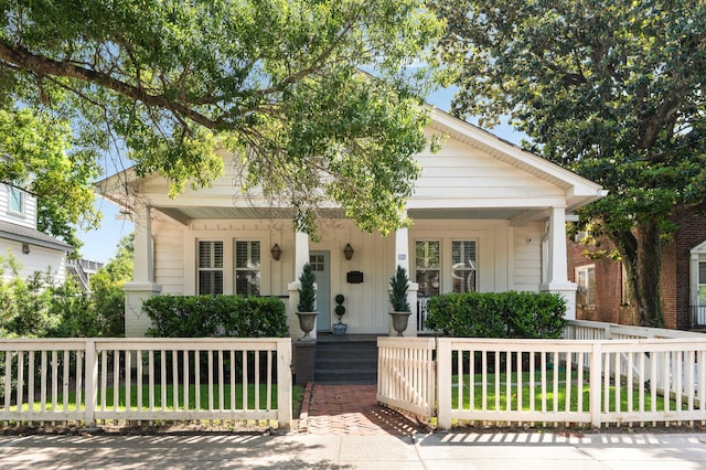 814 Rutledge Ave, Charleston, SC 29403 - bungalow-style house featuring covered porch and a fenced front yard