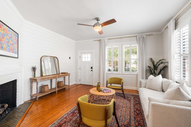 814 Rutledge Ave, Charleston, SC 29403 - living area with a ceiling fan, a fireplace, wood finished floors, ornamental molding, and baseboards