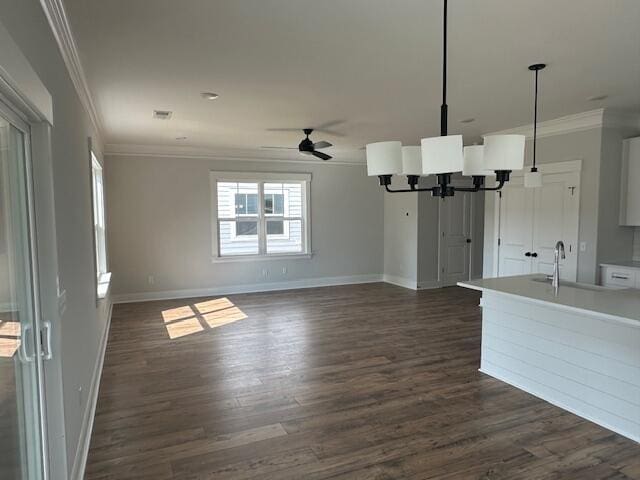 4126 Ohear Ave, North Charleston, SC 29406 - unfurnished living room with a chandelier, ornamental molding, dark wood finished floors, and a ceiling fan