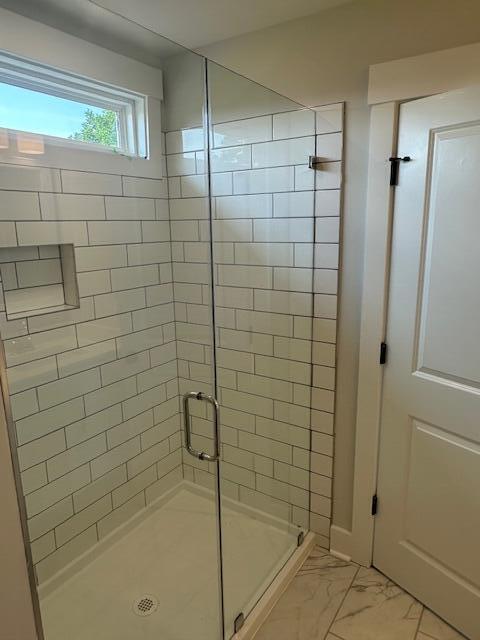 4126 Ohear Ave, North Charleston, SC 29406 - full bath featuring a shower stall and marble look tile flooring