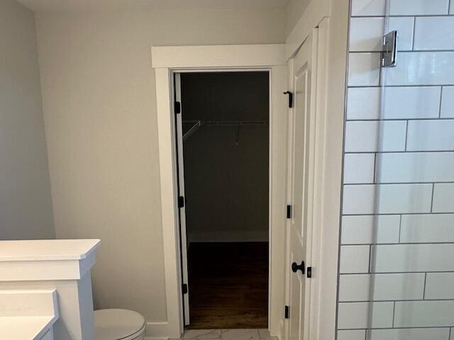 4126 Ohear Ave, North Charleston, SC 29406 - bathroom featuring vanity, tiled shower, marble finish flooring, and a spacious closet