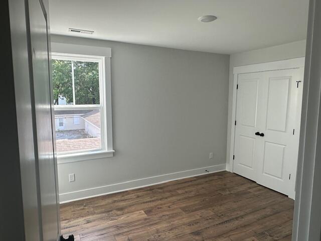 4126 Ohear Ave, North Charleston, SC 29406 - spare room with dark wood-style flooring and baseboards