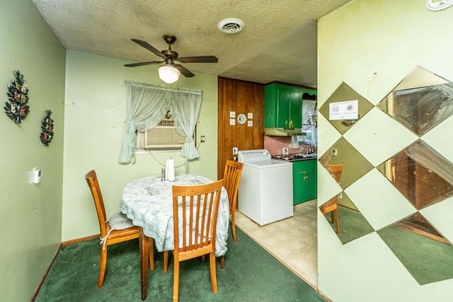 dining room featuring light floors, visible vents, a textured ceiling, washer / dryer, and cooling unit