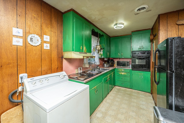 kitchen featuring washer / dryer, visible vents, light floors, black appliances, and green cabinets