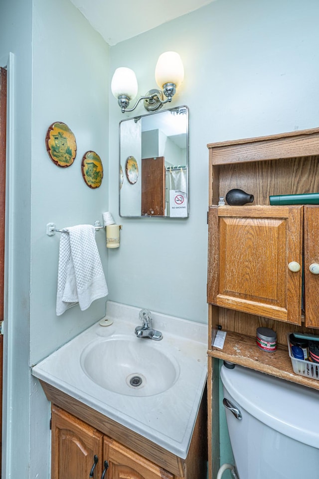 full bath with vanity and toilet