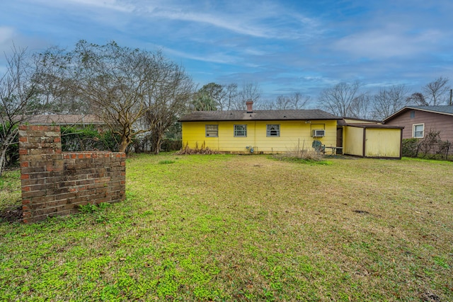 back of house with a yard