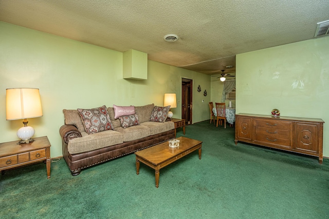 carpeted living room with a textured ceiling, ceiling fan, and visible vents