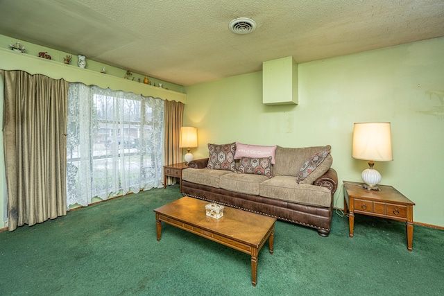 living area with carpet floors, visible vents, and a textured ceiling