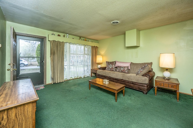 carpeted living area featuring a textured ceiling and visible vents