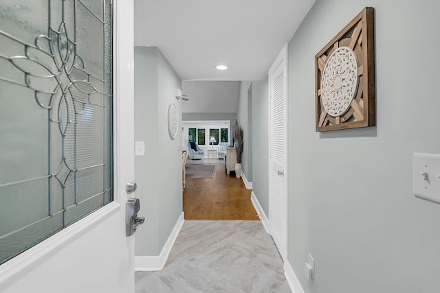 hallway featuring baseboards