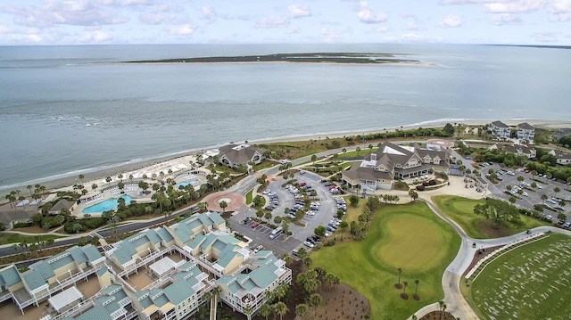 drone / aerial view featuring a residential view and a water view