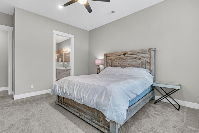 carpeted bedroom featuring ceiling fan and ensuite bathroom