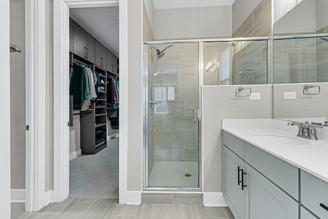 bathroom with an enclosed shower and vanity