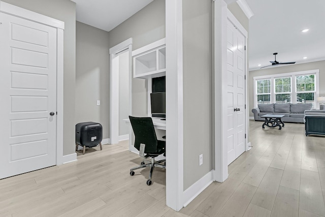 office area with light wood-type flooring and ceiling fan