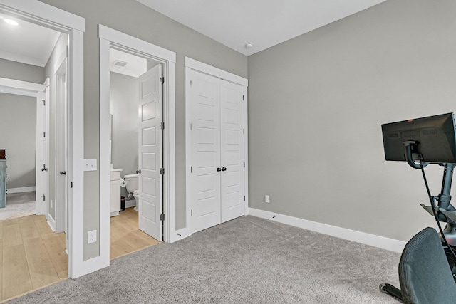 workout area with light colored carpet