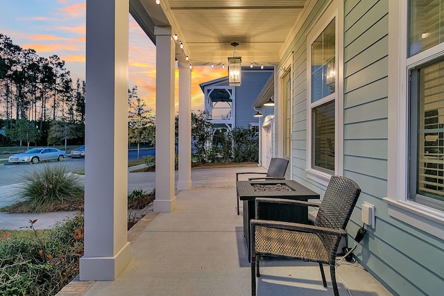 patio terrace at dusk with covered porch