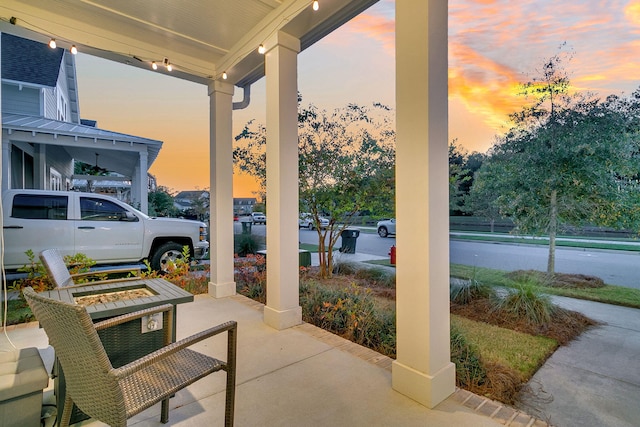 patio terrace at dusk with covered porch