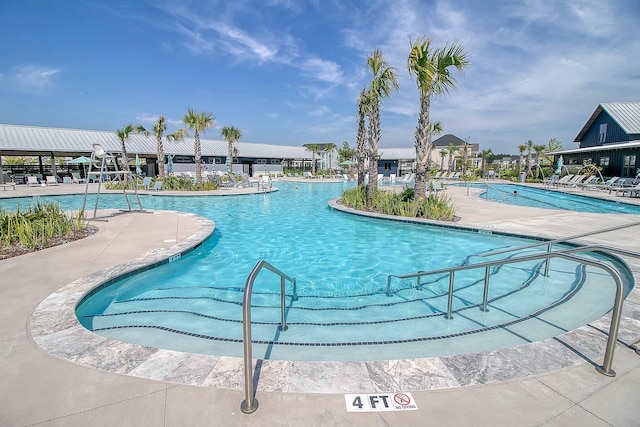 view of pool featuring a patio