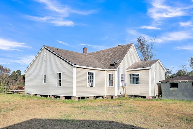 back of property with a yard and cooling unit