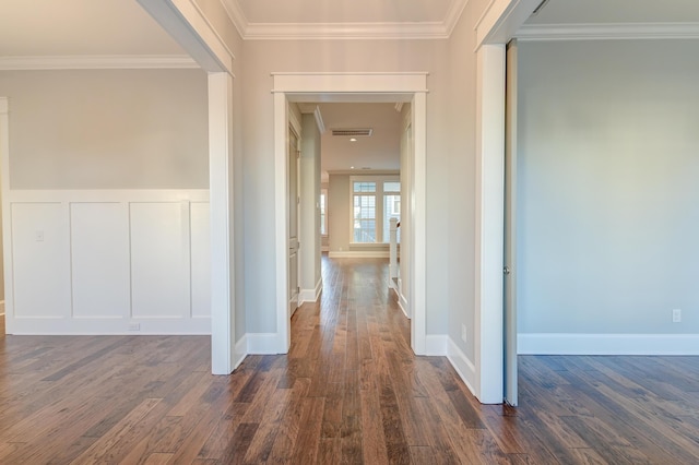 hall featuring crown molding and dark hardwood / wood-style flooring